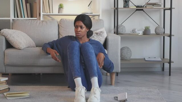 Phone arguing. Aggressive call. Bad customer service. Furious angry screaming woman throwing breaking smartphone at home living room.