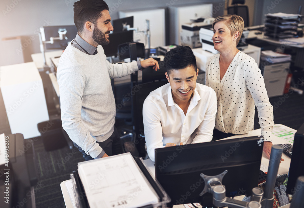 Canvas Prints Working together gets the job done quicker. Shot of creative colleagues working together in the office.