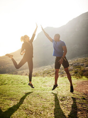 Success depends on your backbone, not your wishbone. Shot of a sporty couple high-fiving after a...
