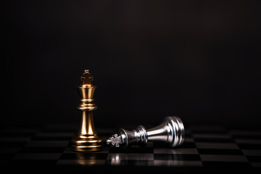 Close Up King Chess Stand With Falling Chess On The Back Concept Of Team Player Or Business Team And Leadership Strategy And Human Resources Organization Management.