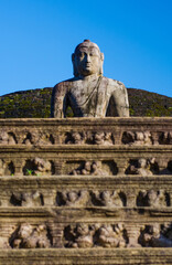 Stone Buddha on the upper platform in the Polonnaruwa Vatadage. It is a circular relic house unique to the architecture of ancient Sri Lanka.