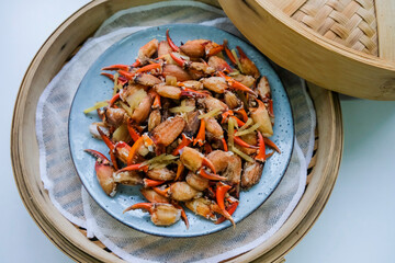 Homemade delicious steamed meal. Steamed Crab Claws with Ginger Strips and Chinese Coriander.