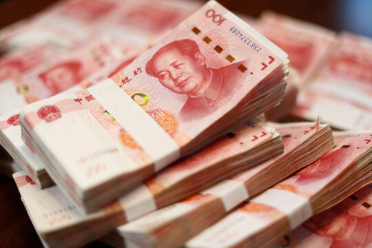 Bundles of Renminbi. Chairman MAO zedong's portrait on the background of 100 Yuan, Chinese banknotes, RMB banknotes. Chinese or Asian economic growth, financial business, the concept of a US trade war