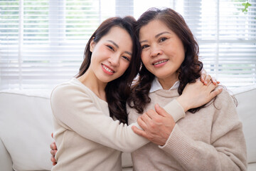 Image of Asian mother and daughter at home
