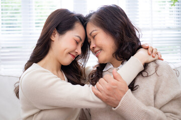 Image of Asian mother and daughter at home - Powered by Adobe