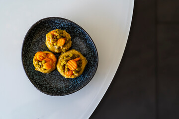 cooked spiny artichoke with olive oil and Carrots and peas,Top view ,selective focos