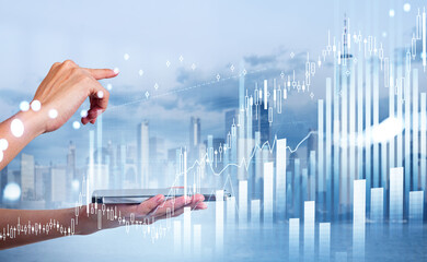 Businesswoman is holding smartphone and touching financial graph with finger