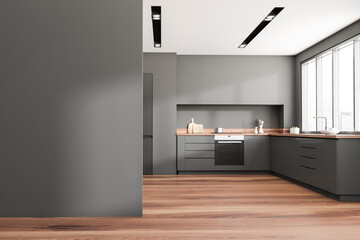 Dark kitchen room interior with empty grey wall, panoramic window