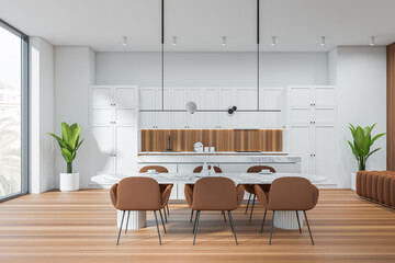 Bright kitchen and dining room interior with panoramic window