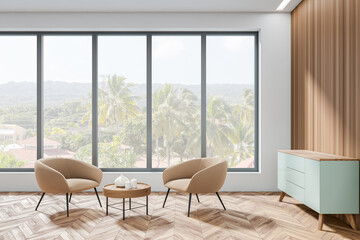 Side view on bright living room interior with panoramic window