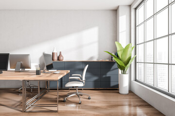 Workplace interior with chairs and computer on table, window. Mockup