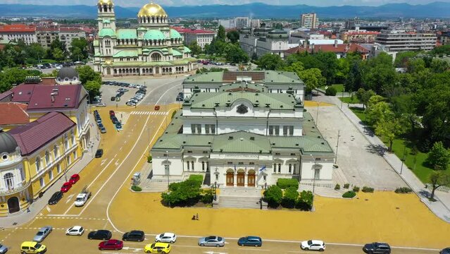 4K Aerial view of capital of Bulgaria, Sofia.Iconic building of the world-famous Sofia. Bulgarian National Assembly. Flight over the Bulgarian Parliament. Roofs of buildings, streets and park in Sofia