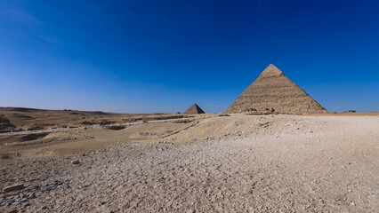 Natural View to the Great Pyramid of Giza under Blue Sky and Day Light - is the oldest and largest of the pyramids in the Giza pyramid complex, Egypt