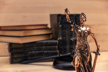 Lady Justice. Law symbols in bokeh background.