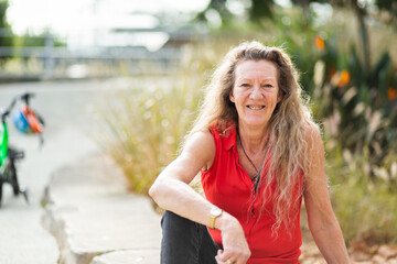 Portrait of a woman in her 50s to 60s outside