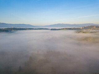 Morning fog in the Ukrainian Carpathians. Aerial drone view.