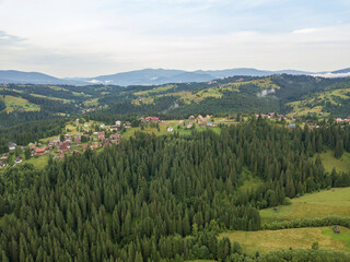 Fototapeta na wymiar Green mountains of Ukrainian Carpathians in summer. Aerial drone view.