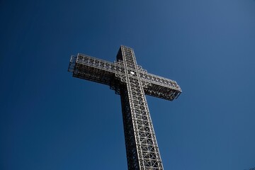 low angle view at the tall metal summit cross on Vodno mountain near Skopje in Macedonia