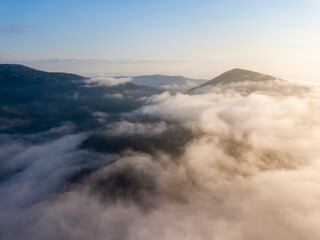 Morning fog in the Ukrainian Carpathians. Aerial drone view.