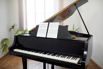 Image of grand piano with sheet music for pianist to play classical music in the classroom