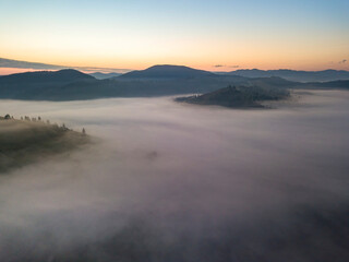 Morning fog in the Ukrainian Carpathians. Aerial drone view.