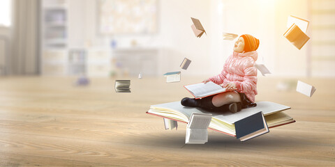Little girl reading a book