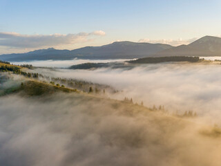 Morning fog in the Ukrainian Carpathians. Aerial drone view.