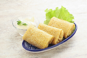 Stuffed pancakes with meat and cream