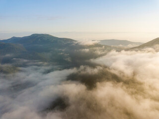 Morning fog in the Ukrainian Carpathians. Aerial drone view.