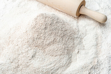 Background with flour. Rolling pin and flour.
