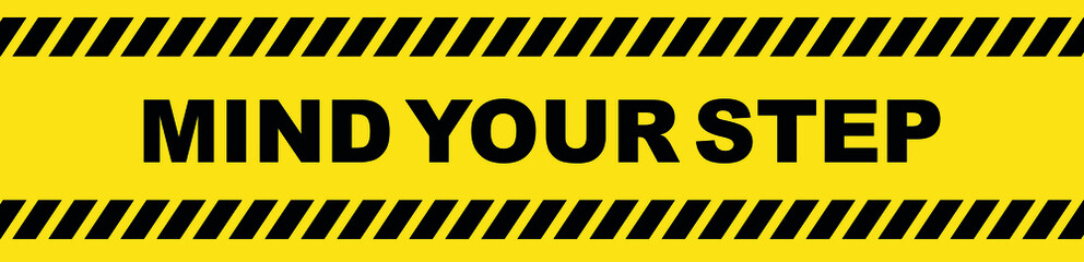 mind your step sign on yellow background