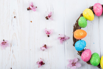 Easter wreath on wooden white background