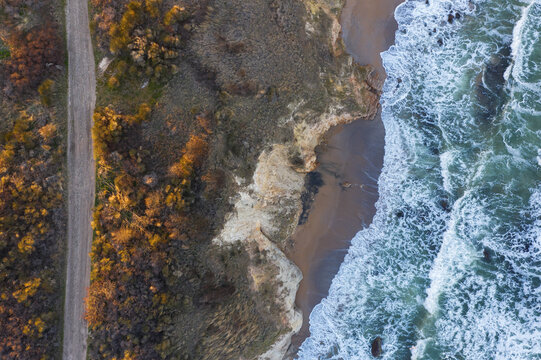 Aerial view to a beautiful wild rocky beach and big waves