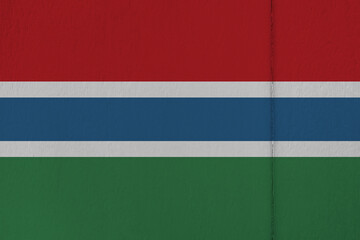 Patriotic wooden background in colors of national flag. Gambia