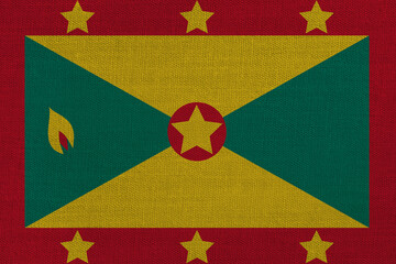 Fototapeta premium Patriotic textile background in colors of national flag. Grenada