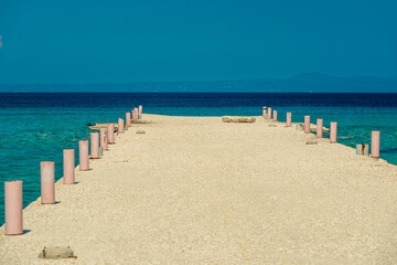 Fototapeta na wymiar Concrete pier and sea on a clear sunny day landscape