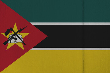 Patriotic wooden background in colors of national flag. Mozambique