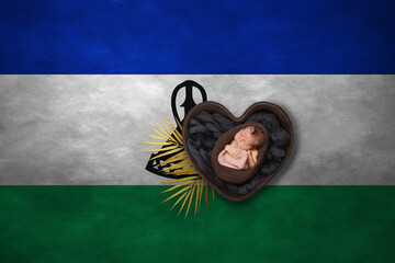 Newborn portrait in heart on background of national flag. Photography peace concept. Lesotho