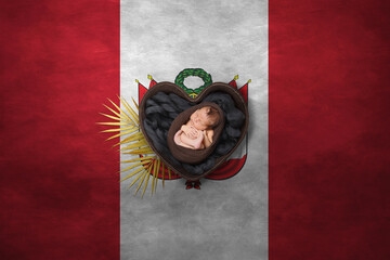 Newborn portrait in heart on background of national flag. Photography peace concept. Peru