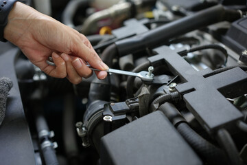 Fototapeta na wymiar Technician engineer check the engine car daily, maintenance and repair concept