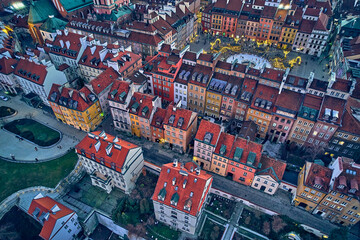 Naklejka premium Beautiful panoramic aerial drone skyline sunset view of the Warsaw City Centre with skyscrapers of the Warsaw City and Warsaw's old town with a market square and a mermaid statue, Poland, EU