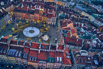 Beautiful panoramic aerial drone skyline sunset view of the Warsaw City Centre with skyscrapers of the Warsaw City and Warsaw's old town with a market square and a mermaid statue, Poland, EU