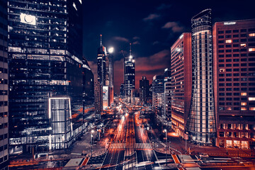 Beautiful panoramic aerial drone skyline view of the center of night Warsaw with skyscrapers in the background on avenues of John Paul II - the lights of the big city by night, Poland, EU - obrazy, fototapety, plakaty