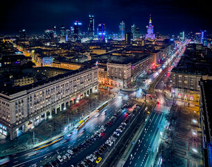 Fototapeta na wymiar Constitution Square (PL: Plac Konstytucji) - a view of the center of night Warsaw with skyscrapers in the background - the lights of the big city by night, Poland, EU