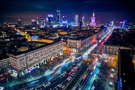 Fototapeta Constitution Square (PL: Plac Konstytucji) - a view of the center of night Warsaw with skyscrapers in the background - the lights of the big city by night, Poland, EU