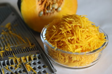 Shredded pumpkin in a glass bowl