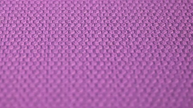 Embossed purple color texture. Geometric pattern on a colored surface.
