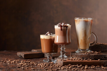 Coffee and chocolate drinks with whipped cream.