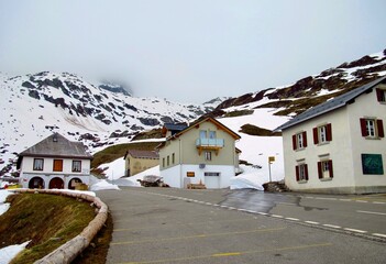 Fototapeta na wymiar Car parking at Swiss pass, road view in Alps 