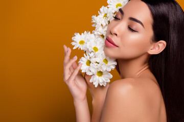 Obraz na płótnie Canvas Photo stunning asian girl flowers visage eyes closed glowing shiny skin botanical balm gel lotion isolated pastel color background